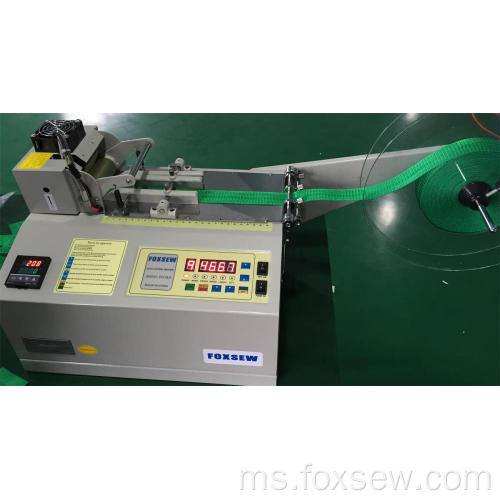 Mesin pemotong pita bersulam automatik